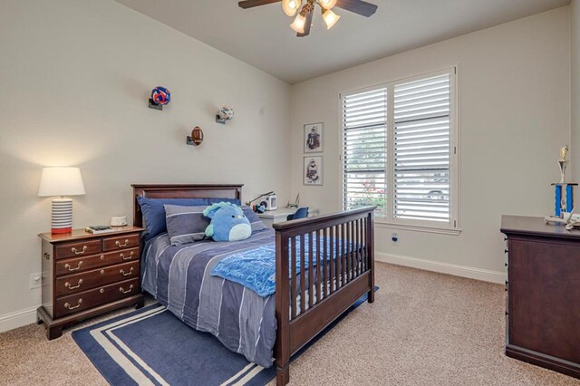 bedroom featuring carpet, baseboards, and a ceiling fan