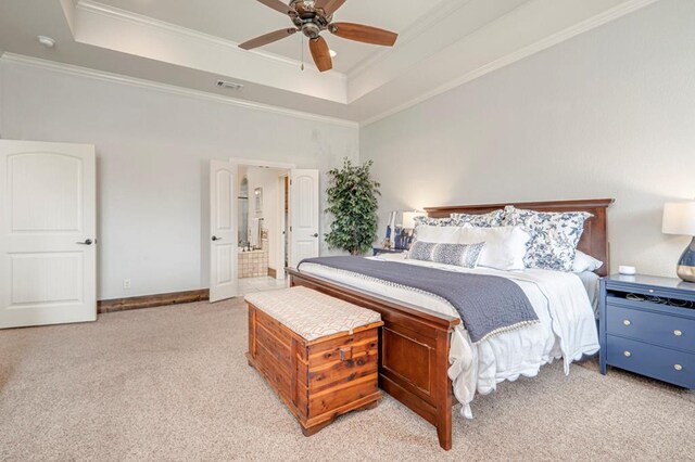 bedroom with a raised ceiling, light colored carpet, crown molding, baseboards, and ceiling fan