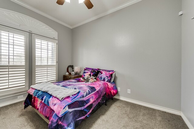 5709 E County Rd 97, Midland, TX 79706 - bedroom with carpet flooring, a ceiling fan, crown molding, and baseboards