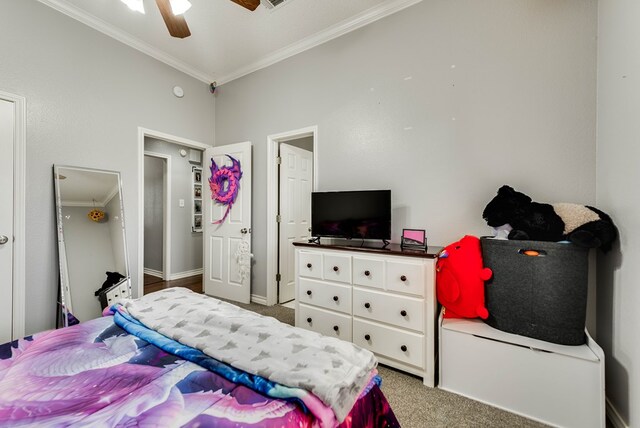 5709 E County Rd 97, Midland, TX 79706 - carpeted bedroom featuring a ceiling fan, ornamental molding, and baseboards