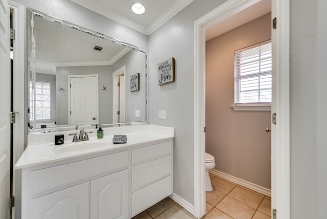 5709 E County Rd 97, Midland, TX 79706 - bathroom with tile patterned floors, visible vents, crown molding, and a wealth of natural light