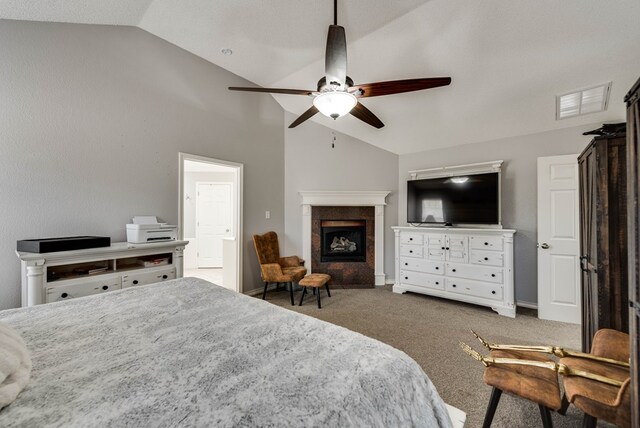 5709 E County Rd 97, Midland, TX 79706 - bedroom featuring a tiled fireplace, lofted ceiling, baseboards, ceiling fan, and carpet