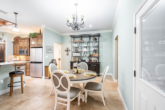 dining space featuring arched walkways, an inviting chandelier, stone tile flooring, visible vents, and crown molding