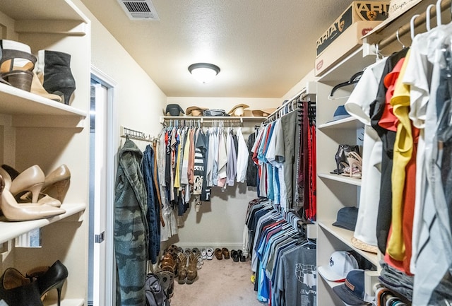 spacious closet featuring visible vents and carpet