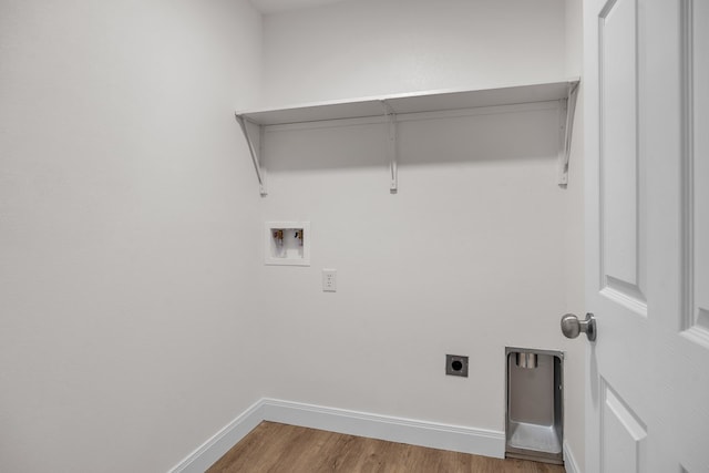 washroom with laundry area, baseboards, wood finished floors, hookup for a washing machine, and hookup for an electric dryer