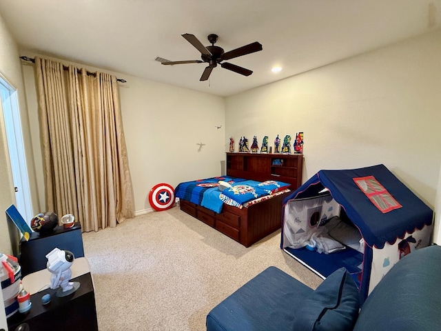 carpeted bedroom with ceiling fan