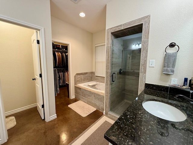 bathroom with vanity and plus walk in shower