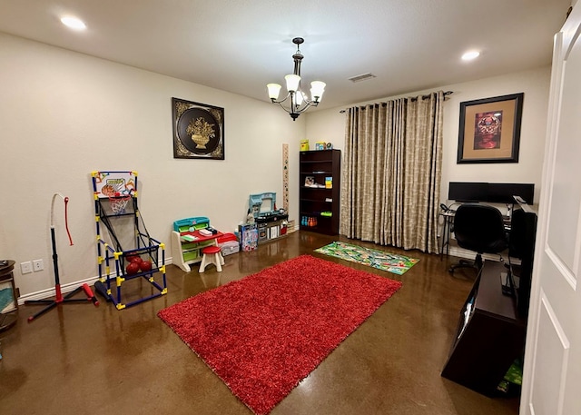 game room with a chandelier