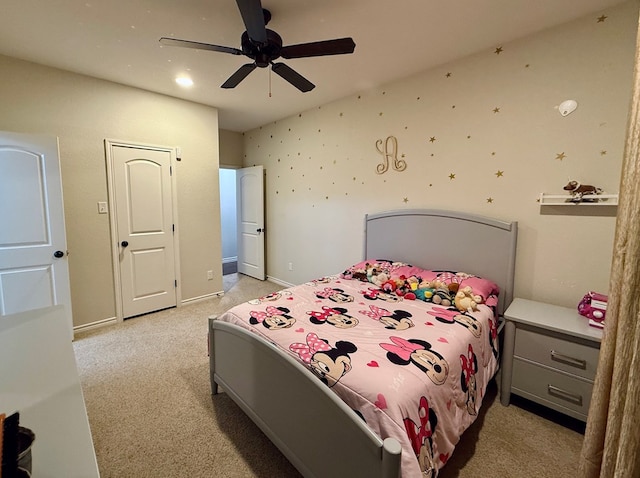 carpeted bedroom featuring ceiling fan