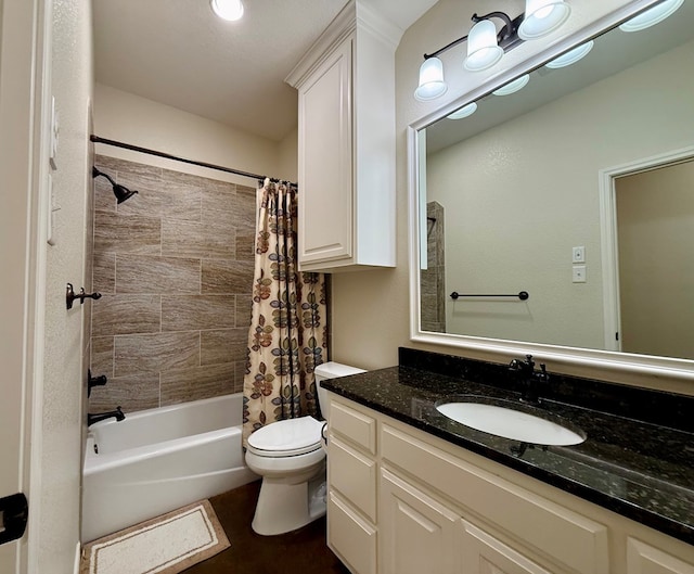 full bathroom featuring shower / tub combo with curtain, vanity, and toilet