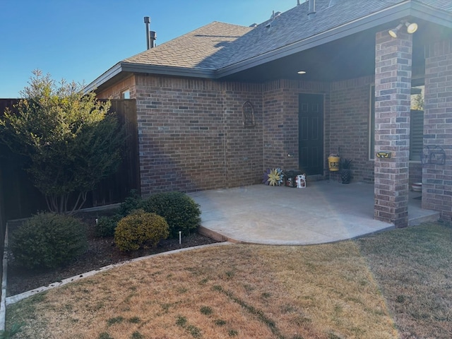 exterior space featuring a patio area and a yard