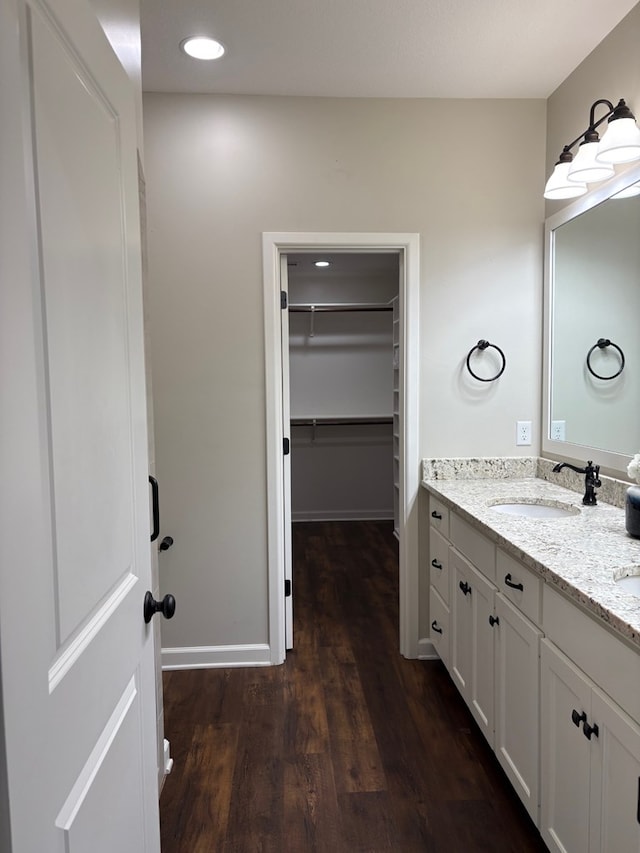 bathroom with vanity and hardwood / wood-style flooring