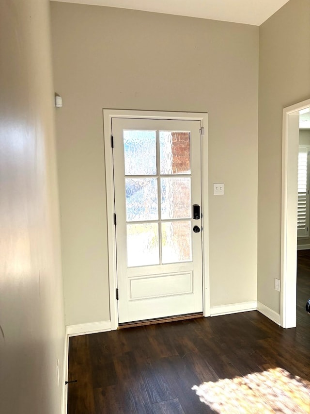 entryway with dark hardwood / wood-style flooring