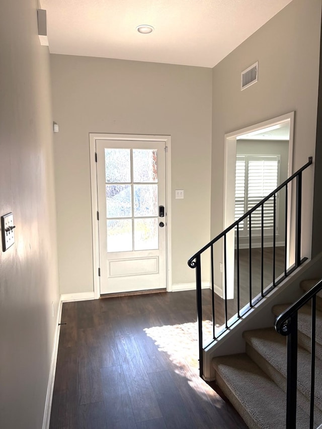 doorway to outside featuring dark hardwood / wood-style floors