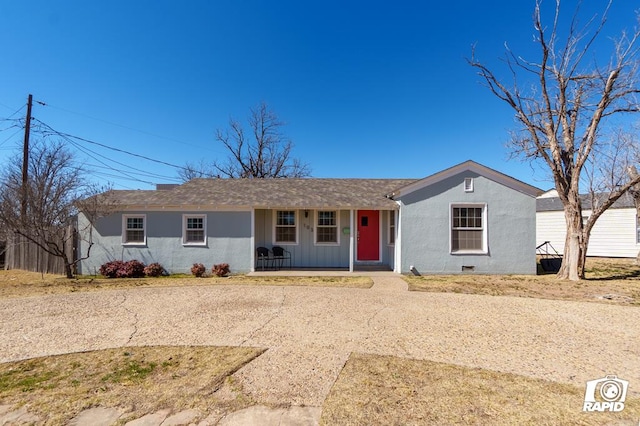 ranch-style house featuring crawl space, covered porch, and stucco siding