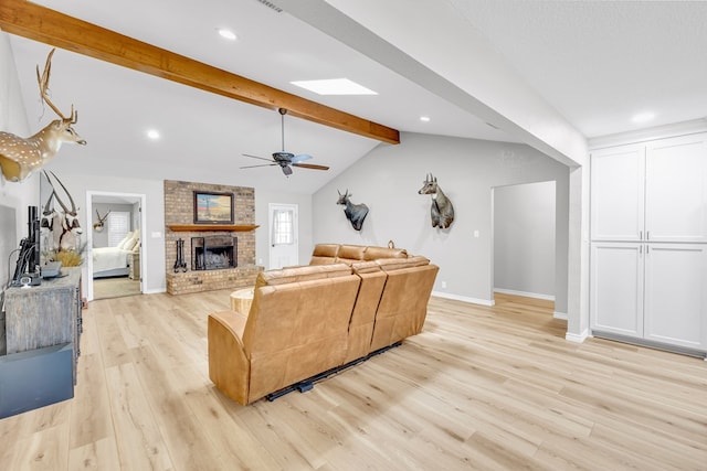 10606 E County Rd 104, Midland, TX 79706 - living area featuring light wood-style floors, a brick fireplace, a ceiling fan, and recessed lighting