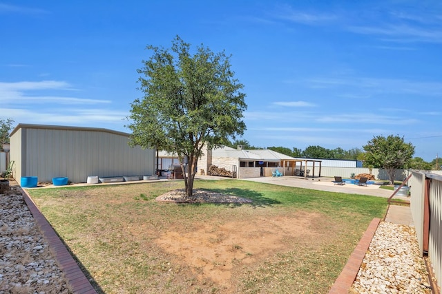 10606 E County Rd 104, Midland, TX 79706 - view of yard featuring a patio and an outbuilding