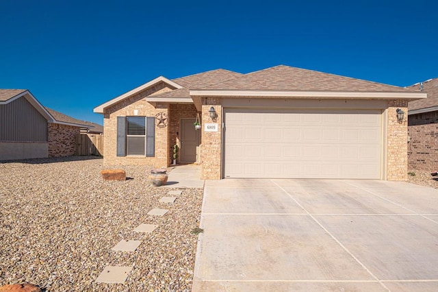 single story home featuring a garage