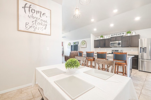 dining space with lofted ceiling