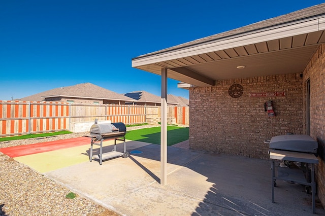 view of patio featuring a grill