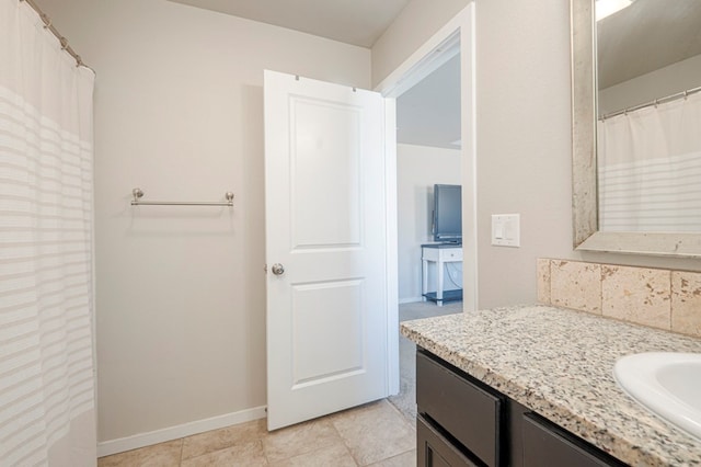 bathroom with vanity and backsplash