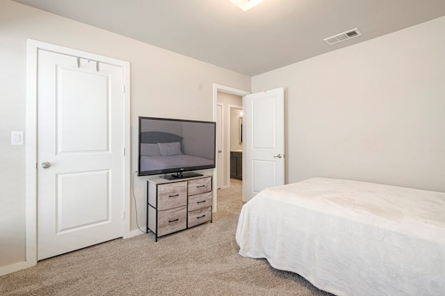 bedroom with light colored carpet