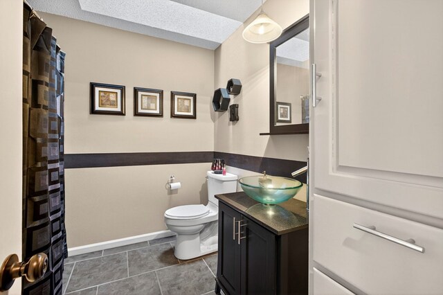 3834 Hyden Dr, Odessa, TX 79762 - bathroom featuring double vanity, a stall shower, a bath, and tile patterned flooring