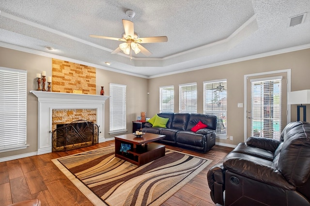 3834 Hyden Dr, Odessa, TX 79762 - kitchen featuring stainless steel fridge, dark wood finished floors, crown molding, a chandelier, and a raised ceiling