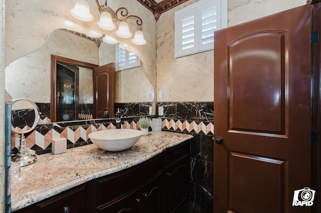 540 SE Loop 338, Odessa, TX 79766 - bathroom featuring vanity, a textured wall, and tile walls