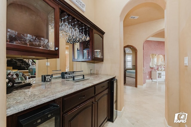 540 SE Loop 338, Odessa, TX 79766 - bar featuring arched walkways, beverage cooler, and light tile patterned floors