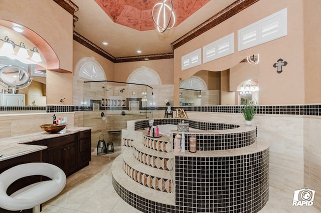 540 SE Loop 338, Odessa, TX 79766 - bathroom with tile walls, ornamental molding, walk in shower, vanity, and tile patterned floors