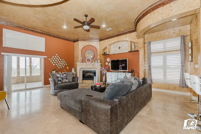 540 SE Loop 338, Odessa, TX 79766 - living area with healthy amount of natural light, ceiling fan, crown molding, and a fireplace