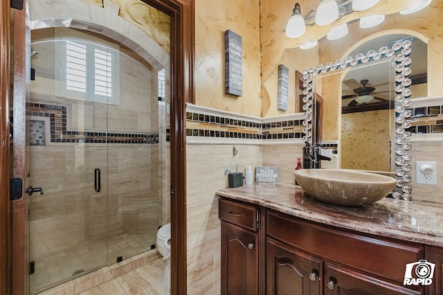 540 SE Loop 338, Odessa, TX 79766 - bathroom featuring vanity, tile walls, and a stall shower