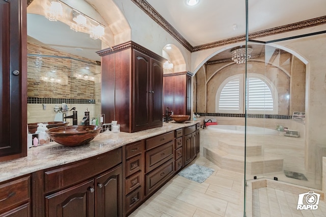 540 SE Loop 338, Odessa, TX 79766 - bathroom with a garden tub, double vanity, a shower with shower door, and tile patterned flooring
