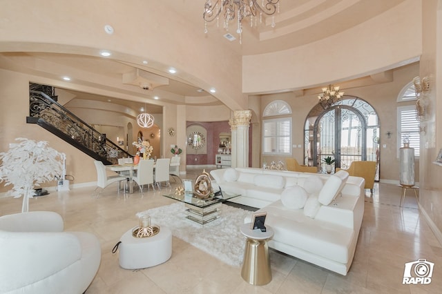 540 SE Loop 338, Odessa, TX 79766 - living area featuring a chandelier, tile patterned floors, arched walkways, recessed lighting, and a towering ceiling