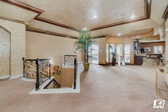 540 SE Loop 338, Odessa, TX 79766 - carpeted living room featuring a raised ceiling, ornamental molding, and french doors