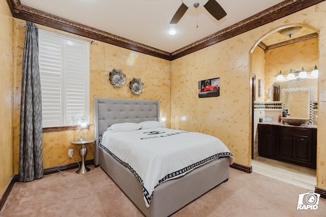 540 SE Loop 338, Odessa, TX 79766 - bedroom featuring ornamental molding, light carpet, ensuite bath, and ceiling fan
