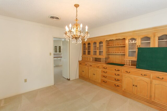 2608 E 24th St, Big Spring, TX 79720 - dining area featuring light carpet, crown molding, and a chandelier