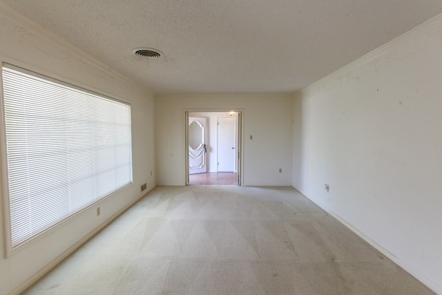 2608 E 24th St, Big Spring, TX 79720 - empty room with light carpet, a textured ceiling, and crown molding