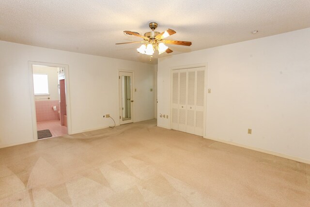 2608 E 24th St, Big Spring, TX 79720 - empty room featuring light carpet, ceiling fan, and a textured ceiling