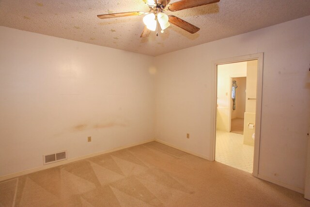 2608 E 24th St, Big Spring, TX 79720 - empty room with light colored carpet, a ceiling fan, and a textured ceiling