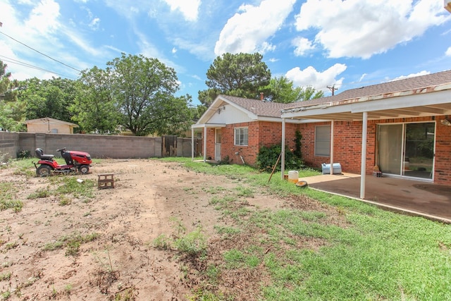 2608 E 24th St, Big Spring, TX 79720 - fenced backyard with a patio area