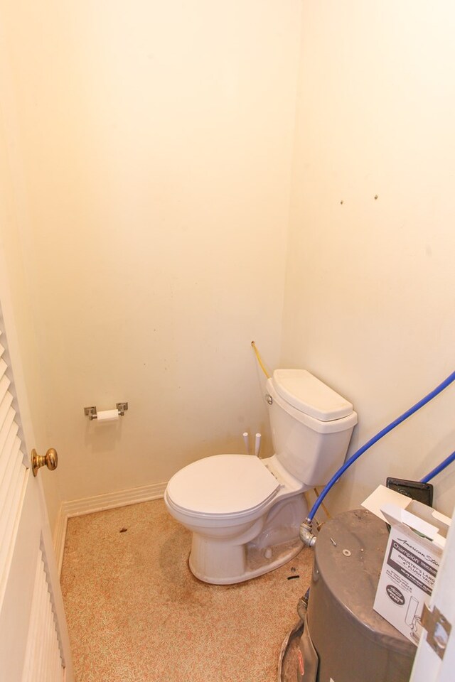 2608 E 24th St, Big Spring, TX 79720 - bathroom with toilet and baseboards