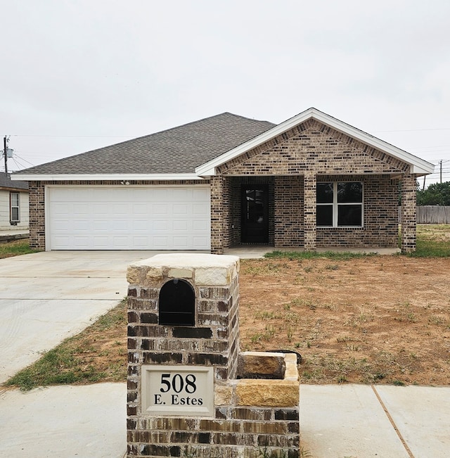 508 E Estes Ave, Midland, TX 79701 - single story home featuring brick siding, driveway, a garage, and roof with shingles