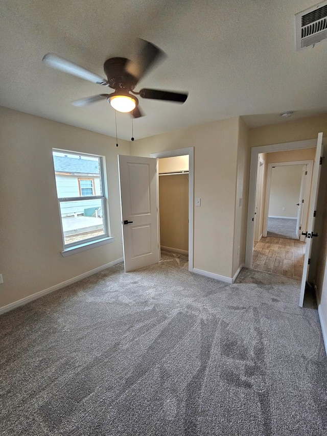 508 E Estes Ave, Midland, TX 79701 - unfurnished bedroom featuring carpet flooring, baseboards, a textured ceiling, and ceiling fan