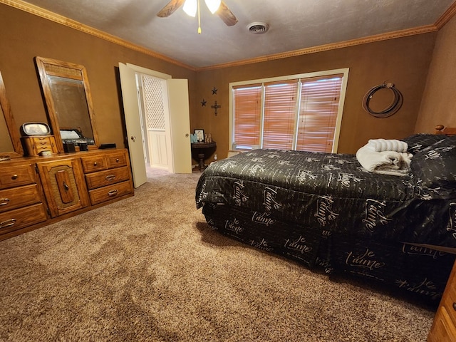 carpeted bedroom featuring ceiling fan and crown molding