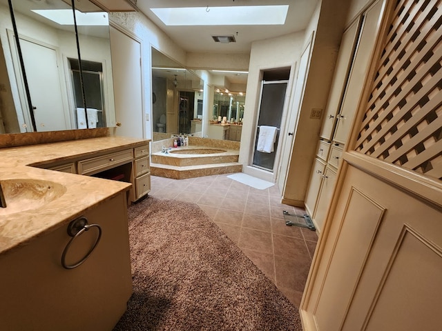 bathroom featuring tile patterned floors, vanity, and plus walk in shower