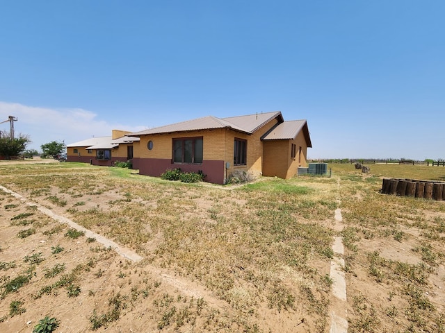 view of front of property with a rural view