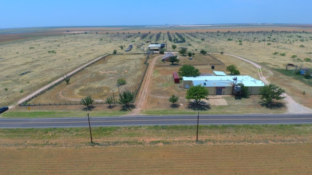 birds eye view of property with a rural view