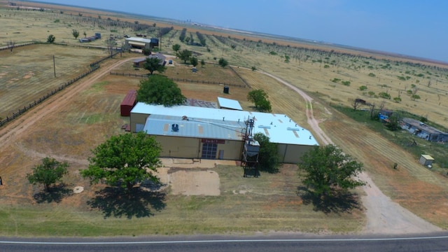 birds eye view of property with a rural view